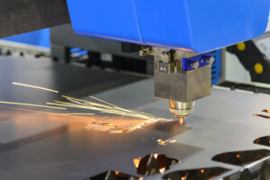 The CNC fiber laser cutting machine cutting the metal plate.